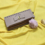 Stylish Off White colour with Pom Pom Clutch for Stylish Ladies
