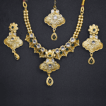 Gold Plated Stone Studded Temple Jewellery Set with Maangtikka
